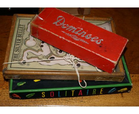 Vintage game of skill called The Silver Bullet - guiding a ball bearing through Germany to Berlin, a set of dominoes depictin