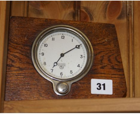 Art Deco Smiths mantle clock with front winder in an oak case