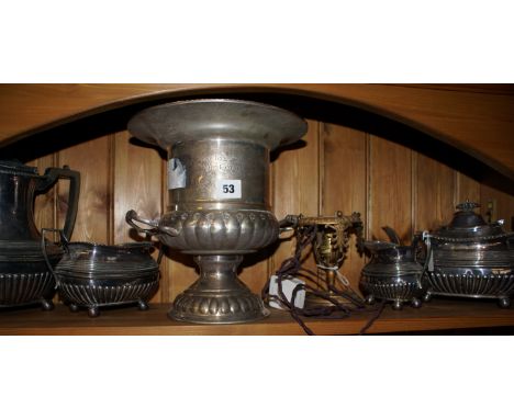 Four-piece EPNS tea service, a presentation EPNS wine cooler Tyne Tees Skal Golf Society and a Victorian brass lamp base