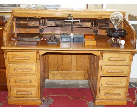 Early 20th century light oak fitted roll top desk
