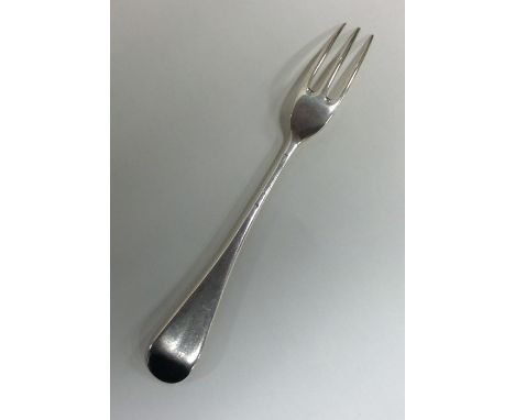 A Georgian silver Hanoverian pattern three prong fork. London. Approx. 57 grams. Est. £45 - £55.