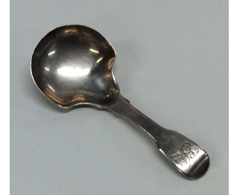 A Georgian silver fiddle pattern caddy spoon. London. By HS. Approx. 18 grams. Est. £40 - £60.