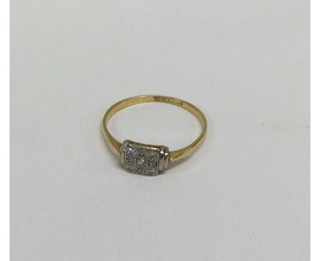 An Art Deco diamond ring mounted in gold and platinum. Approx. 2 grams. Est. £30 - £50.