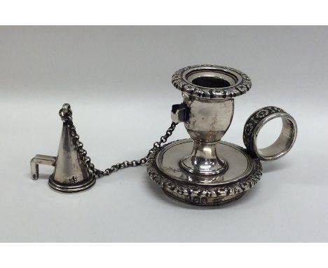 A small Georgian silver chamber stick embossed with flowers and leaves. London. By RP&amp;GB. Approx. 116 grams. Est. £120 - 