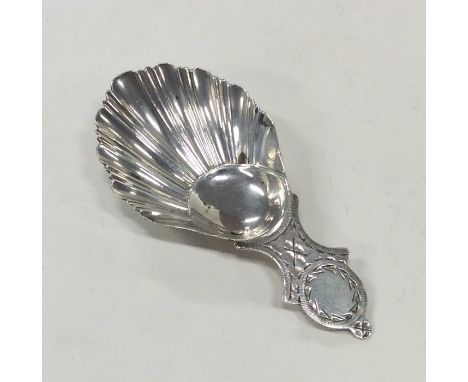 An attractive silver bright cut caddy spoon with fluted bowl engraved with flowers. Sheffield. Approx. 15 grams. Est. £30 - £