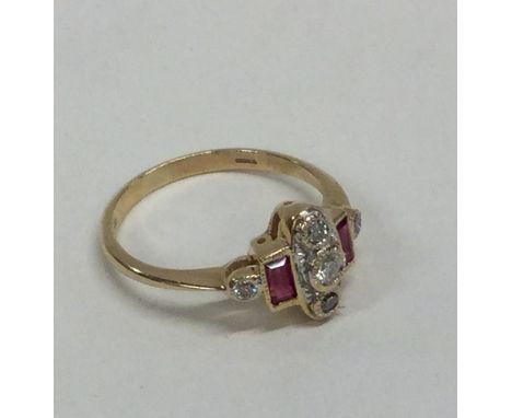 A ruby and diamond ring set in 9 carat mount. Approx. 2.3 grams. Est. £25 - £35.