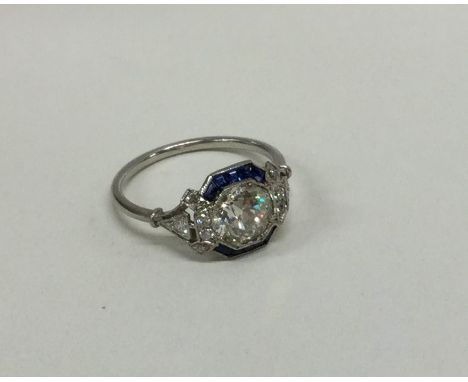 An attractive French platinum sapphire and diamond cocktail ring on plain band, the central stone approx. 1.5 carats. Approx.