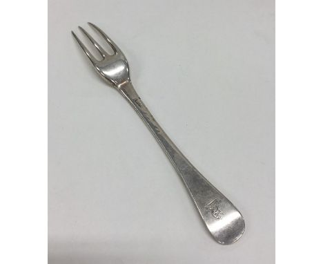 A Georgian silver Hanoverian pattern three prong fork with crested terminal. Approx. 62 grams. Est. £60 - £80.