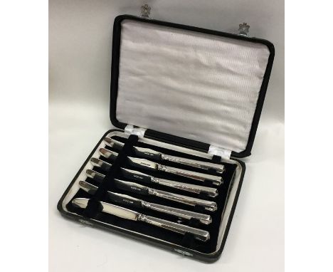 A boxed set of six silver bladed tea knives. London. By JD&amp;S. Approx. 150 grams. Est. £30 - £40.