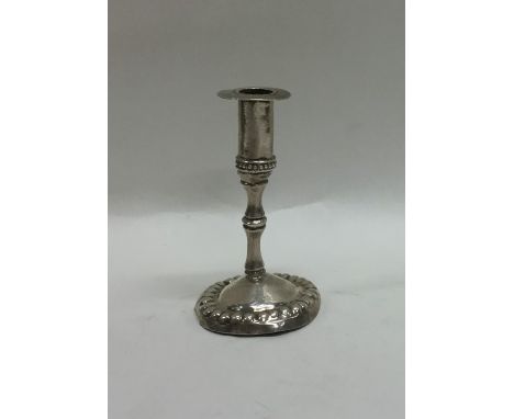 An Antique silver chamber stick with ball decoration. Approx. 19 grams. Est. £30 - £40.