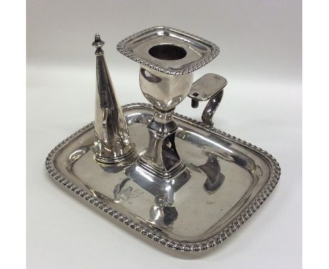 A good rectangular Georgian silver chamber stick together with snuffer. London. By WB. Approx. 324 grams. Est. £200 - £300.