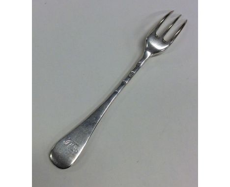 A Georgian silver Hanoverian pattern three prong fork. London. Approx. 63 grams. Est. £45 - £55.