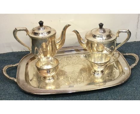 A silver plated tea service on tray. Est. £20 - £30.