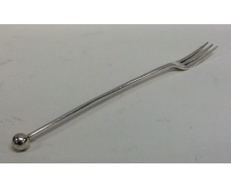 A silver tapering pickle fork with ball terminal. London. By JD&amp;S. Approx. 20 grams. Est. £20 - £30.