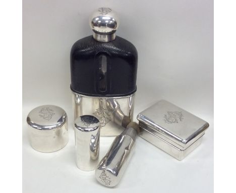 A huge French silver scent flask together with a silver soap box, a silver shaving brush etc. Est. £150 - £200.