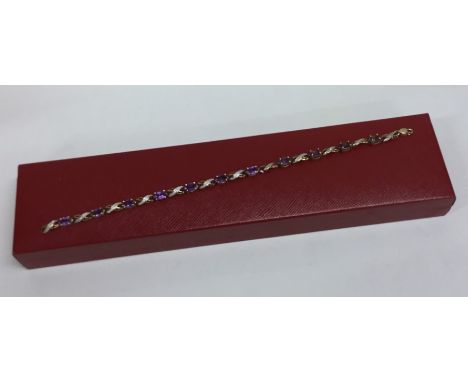 An amethyst mounted bracelet with ring clasp. Approx. 6 grams. Est. £100 - £150.