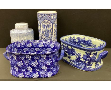 20th century Chinese blue and white jar and cover, 34cm high umbrella stand, iron stone foot baths; other (4)
