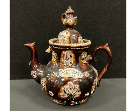 A 19th century Derbyshire 'barge ware' teapot and cover, inscribed 'A present from from Swadlincote 1892', decorated with flo