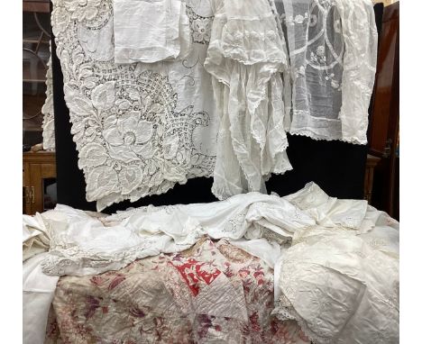 A mid 20th century patchwork quilt, with multitone floral panels in tones of red, pink, green, cream, approx 208cm  x 200cm; 