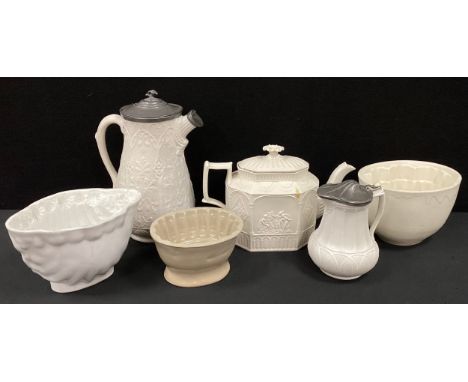 Georgian Castleford white stoneware tea pot, moulded in relief columned panels containing scenes of people and patterns, 17cm