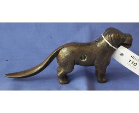 Heavy cast metal nutcracker in the form of a standing dog. 