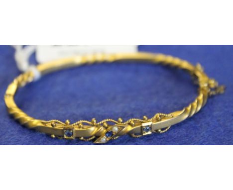 9ct gold pearl and sapphire twist design bangle.  CONDITION REPORT: No obvious damage