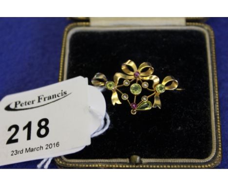 Edwardian 9ct gold peridot bow design brooch.  CONDITION REPORT: No obvious damage
