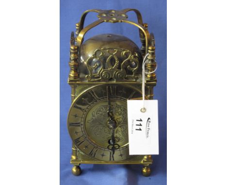 Modern brass lantern clock.