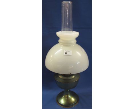 Plated metal pedestal oil lamp with white glass shade and clear chimney. 