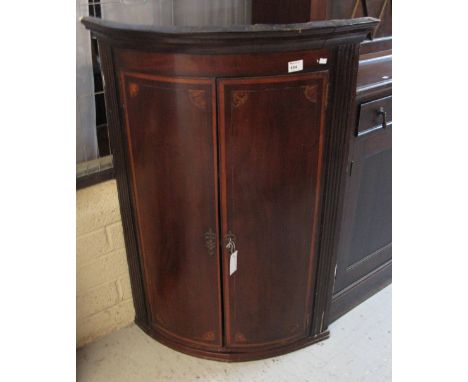 18th Century mahogany bow fronted hanging corner cupboard.