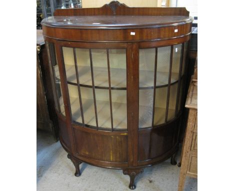 Early 20th Century mahogany bow front display cabinet on cabriole legs. 