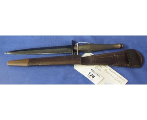 British Fairbairn Sykes commando fighting knife, with straight guard and engine turned brass handle. Metal mounted metal scab