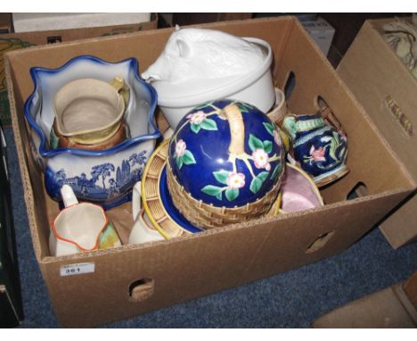 Box of assorted china to include various majolica foliate and floral jugs, majolica stilton bell and cover, set of three grad