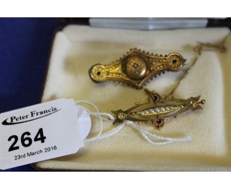 15ct gold Etruscan revival brooch and 15ct pearl and garnet brooch in box. (2)