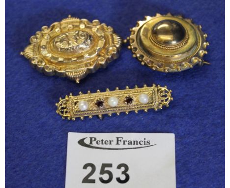 9ct gold garnet and pearl brooch together with another 9ct gold brooch and another yellow metal brooch. 