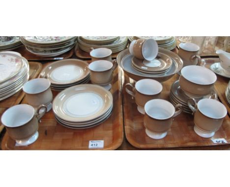 Two trays of Denby brown and cream coffee ware and other items comprising coffee mugs and saucers, milk jugs, sugar bowl, ped