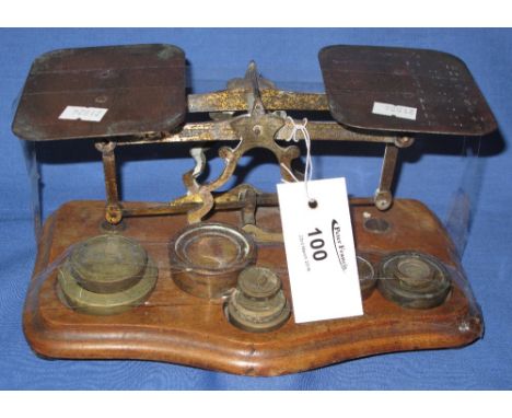 Set of brass Smith & Sons postal scales with weights on moulded wooden base. 
