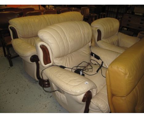 Modern cream leather three piece suite comprising three seater sofa, armchair and another similar electric armchair. (3)