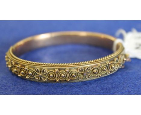 9ct gold Victorian bangle in Etruscan revival style.  CONDITION REPORT: Wear and scratches in places but appears complete.