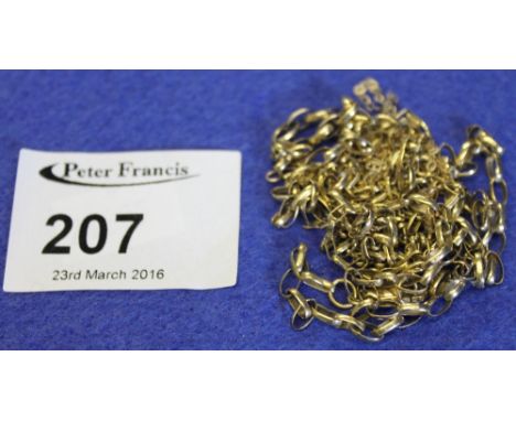 Loose yellow metal chain.