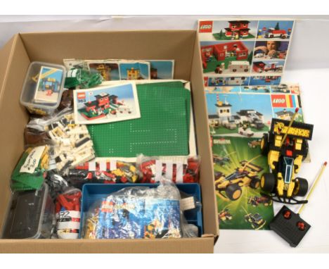 A large quantity of assorted loose Lego, Includes set specific parts, Base boards, Instruction manuals, Also includes Radio C