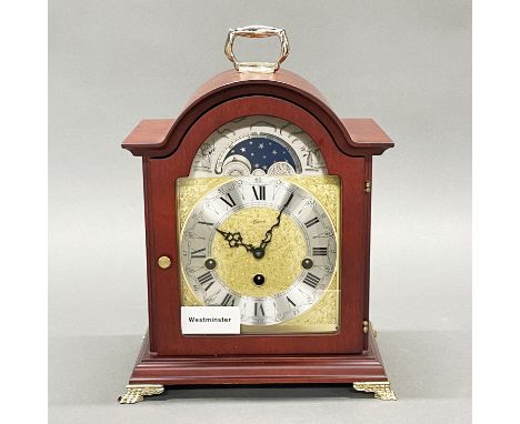 An ex shop stock Westminster chiming moon phase mantel clock, H. 30cm.