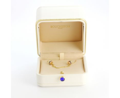 A boxed Boucheron 18ct gold ruby and diamond bracelet set with rubies and brilliant cut diamonds, with sliding size adjustmen