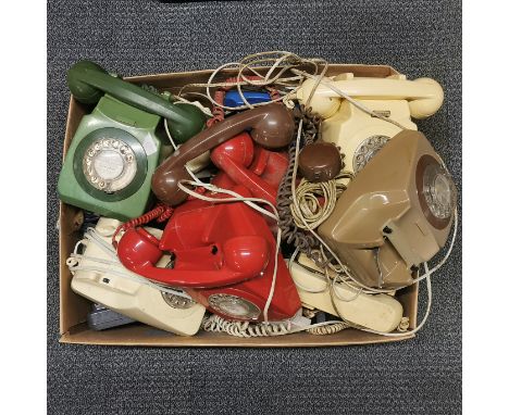 A box of vintage telephones.