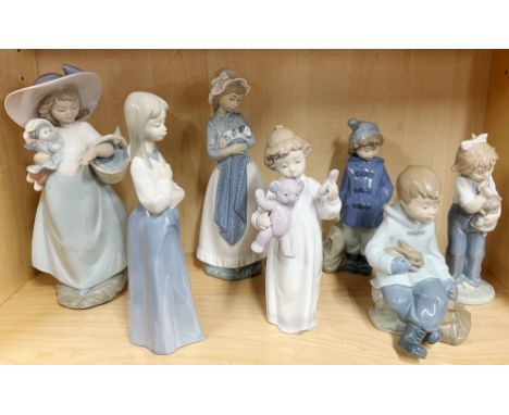 A group of seven Nao figures of children, H. 25cm.