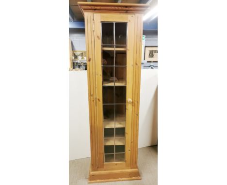 A thin pine five shelf display cabinet, 183 x 61 x 43cm.