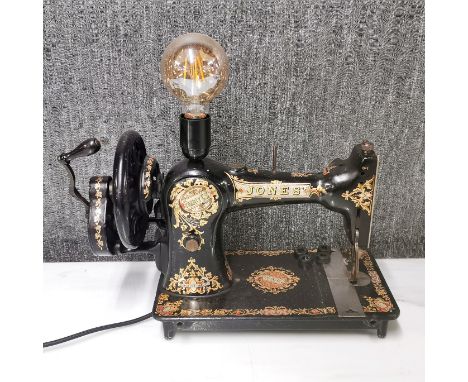 An interesting table lamp converted from a vintage Jones hand operated sewing machine, H. 36cm L. 42cm.