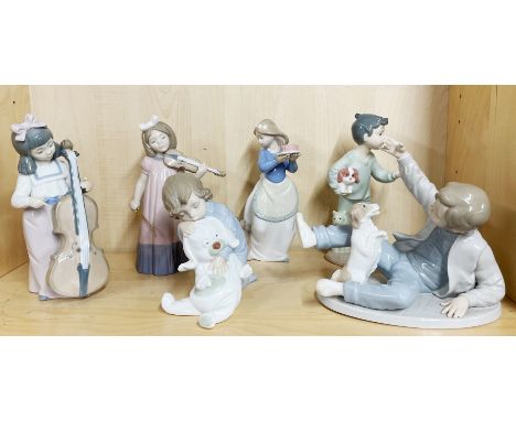 A group of six Nao figurines of children, tallest. 19cm. Hand repaired to girl holding cake.