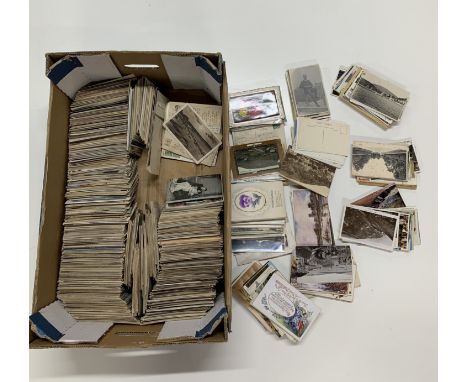 A large box containing over 2000 antique and vintage postcards.