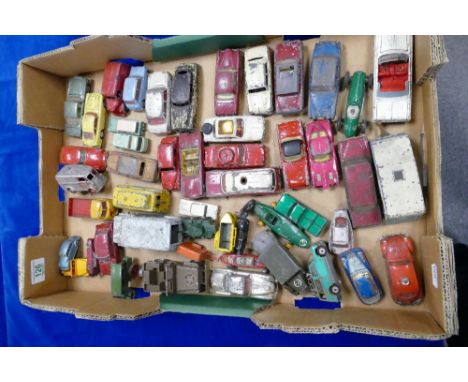 A collection of Corgi and Dinky model toy cars and vans in varying states of repair 